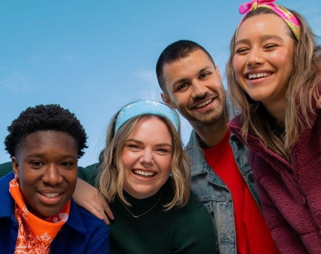 Four young people smiling at the camera wearing Canteen bandannas