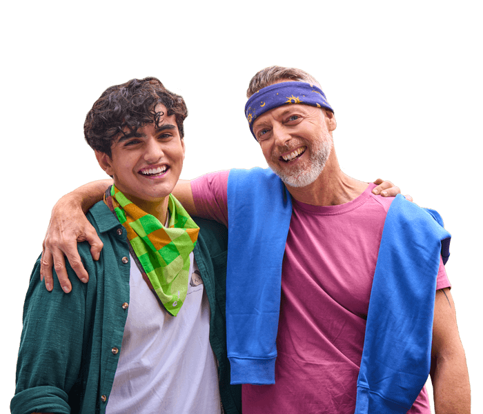 two males with their arms around one another wearing canteen bandannas