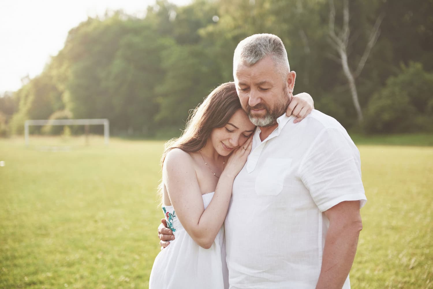 daughter and father hugging