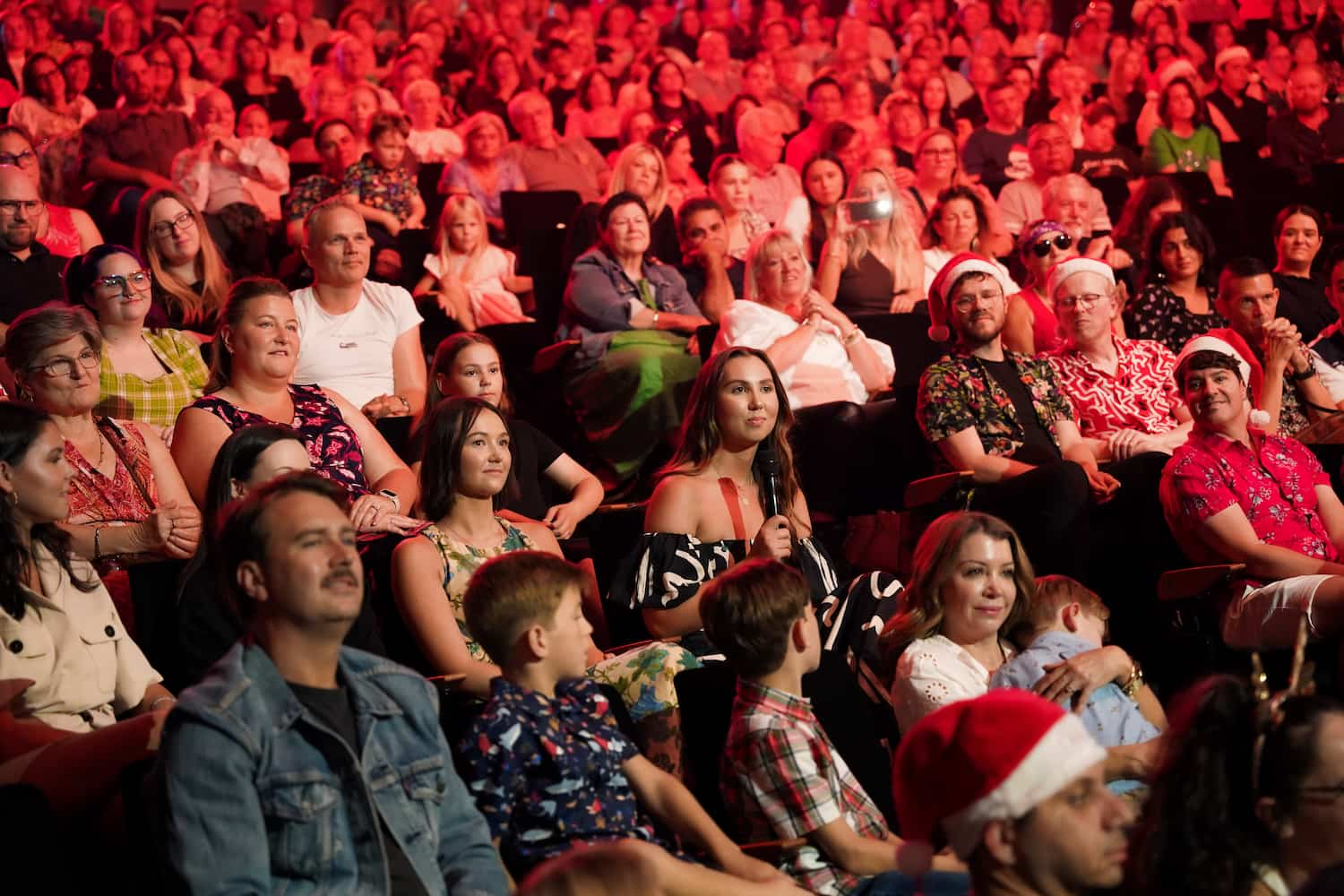 Molly and friend Meredith in the audience at Christmas with Delta