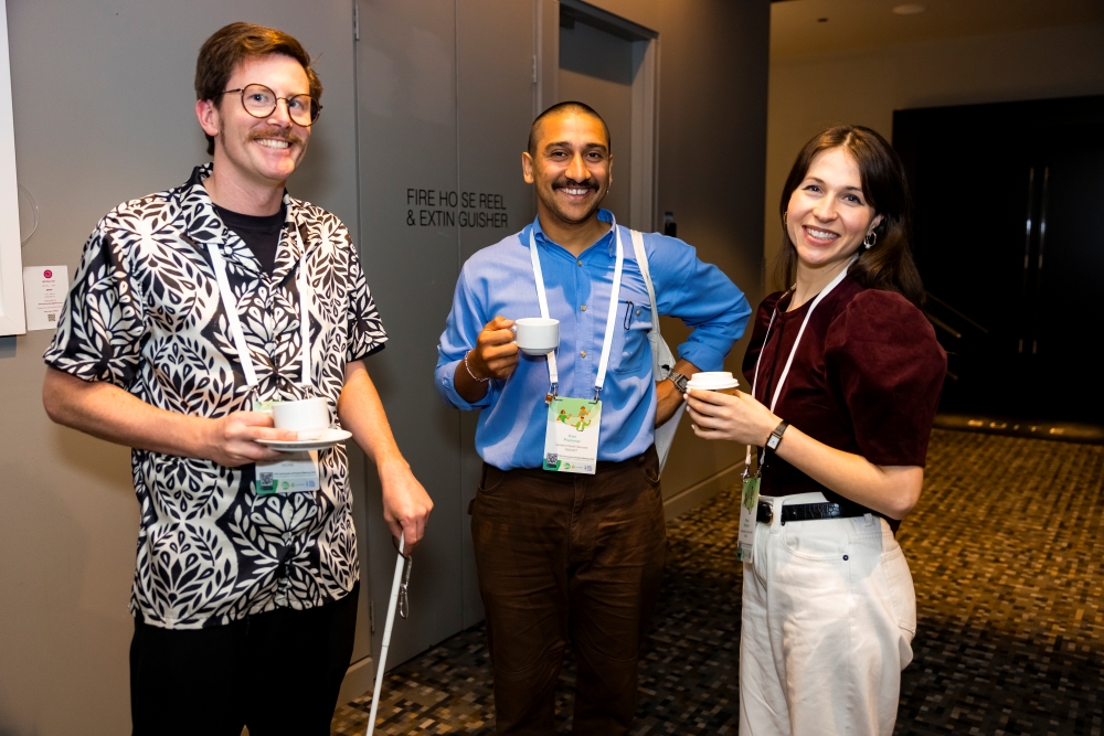 Community of Practice Meeting attendes chatting over coffee