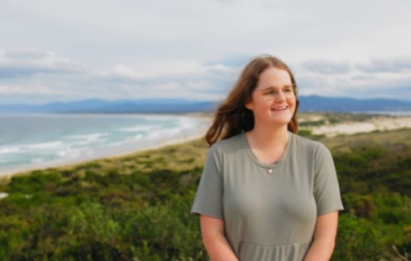 image of georgia standing near the beach 