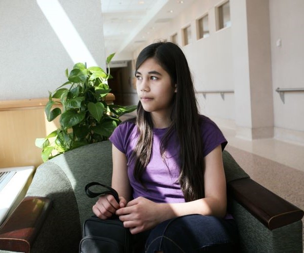 young person in a hospital waiting room