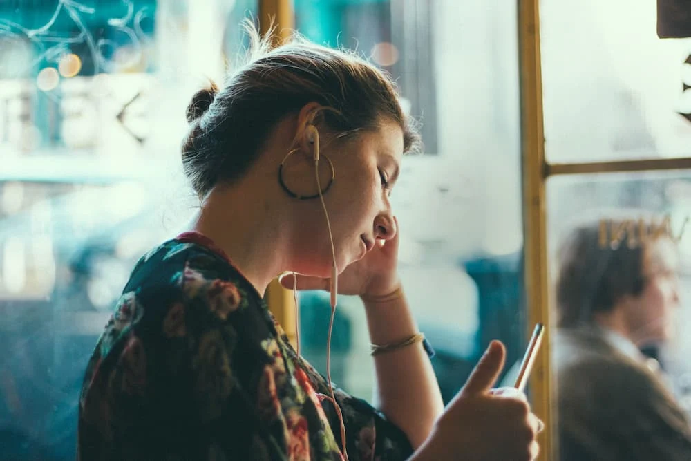 young person listening to canteen's cancer unscripted podcast