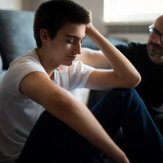 Son discussing cancer with his Father