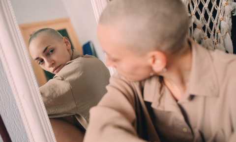 Girl looking at her reflection