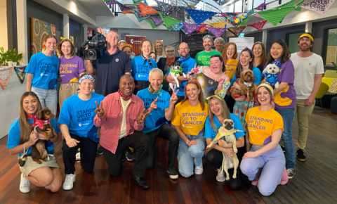 group of canteen staff, dogs and studio 10 at bandanna day