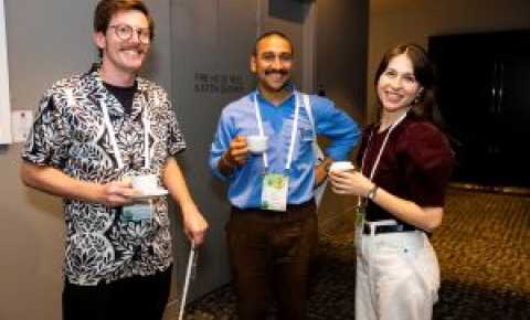 Community of Practice Meeting attendees chatting over coffee