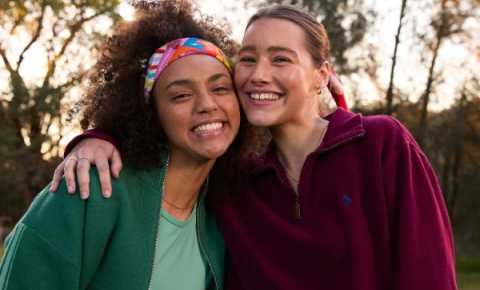 Two young women wearing Canteen bandannas smiling at the camera