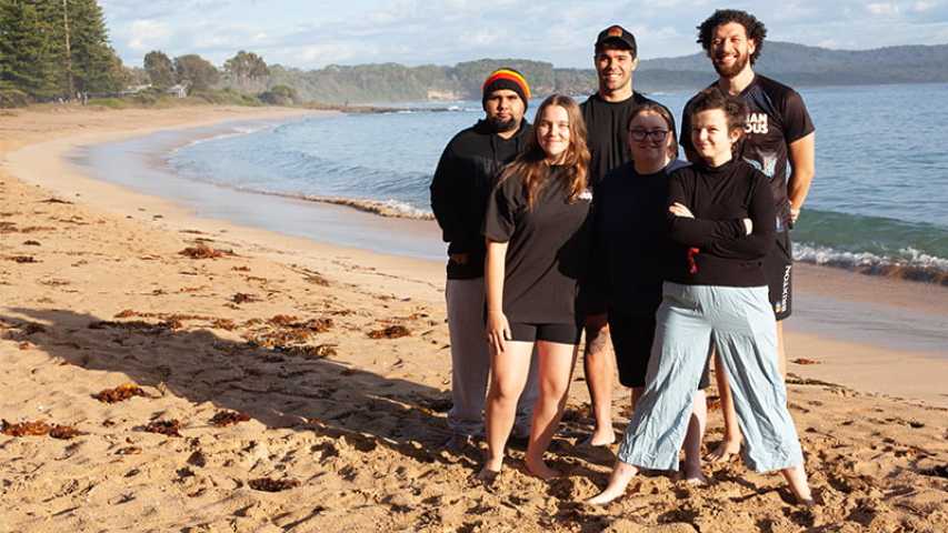 five young people standing on the shore of the beach at the canteen first nations cultural program