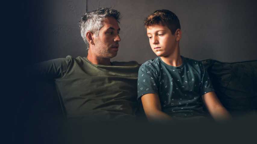 Father talking to son about cancer