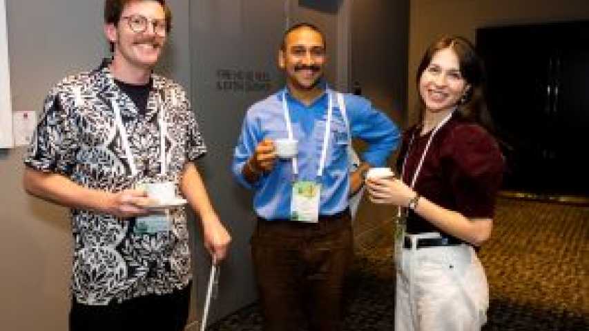 Community of Practice Meeting attendees chatting over coffee