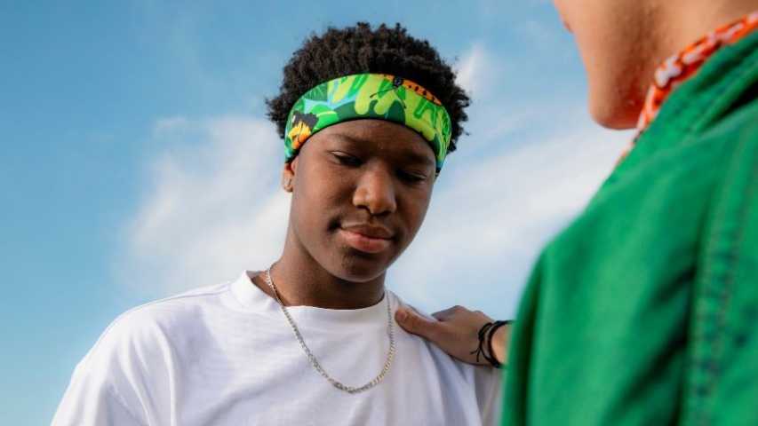 a young person getting consoled by a friend