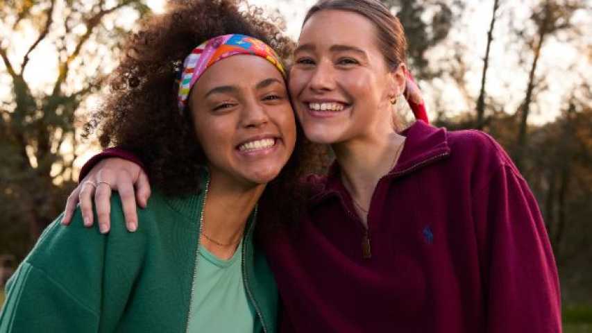 Two young women wearing Canteen bandannas smiling at the camera