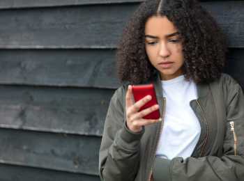 Girl seeking information about cancer on phone